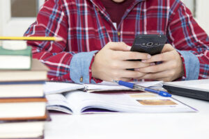 child-with-the-cellphone-at-school