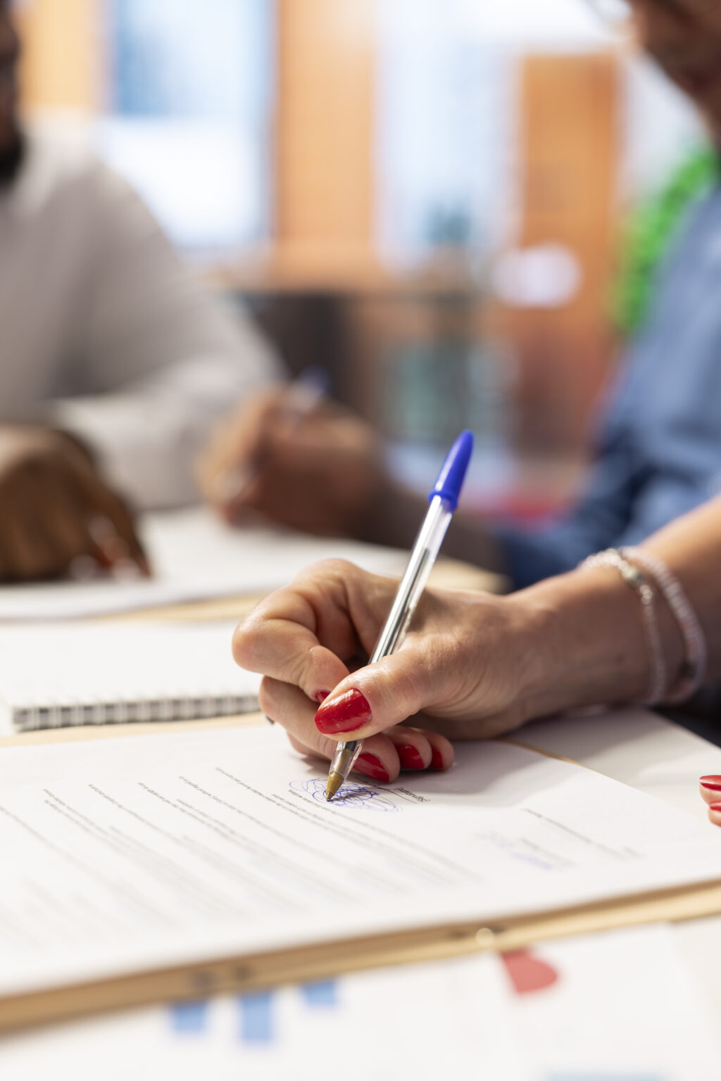 Mature client signing the pension plan contract with broker