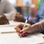 Mature client signing the pension plan contract with broker