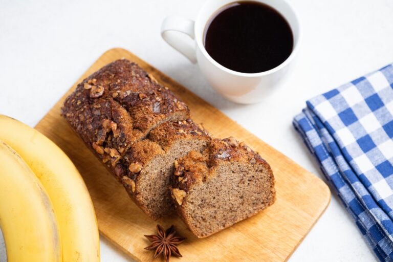 Vegan,Banana,Bread,With,Walnuts,On,A,Wooden,Cutting,Board