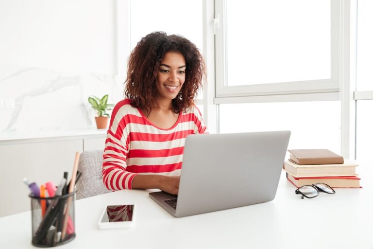 busy-woman-in-casual-clothes-working-on-laptop-at-home