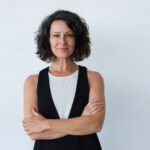 Cheerful middle aged woman with curly hair